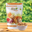 Raw Brazil Nuts unsalted on wooden ground in resealable pack with small bowl brazil nuts inside with green background by Anna and Sarah