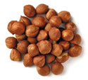 Unshelled hazelnuts with white background by Anna and Sarah