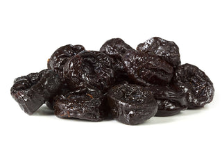 Dried Prunes Plums white background by Anna and Sarah