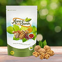 Walnuts on the wooden ground in resealable pack with green background by Anna and Sarah