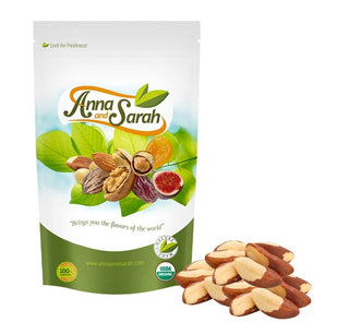Organic Brazil Nuts on the white ground in resealable pack and some nut next to it by Anna and Sarah