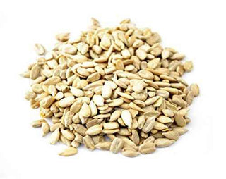 Raw Sunflower Kernels on the white ground by Anna and Sarah